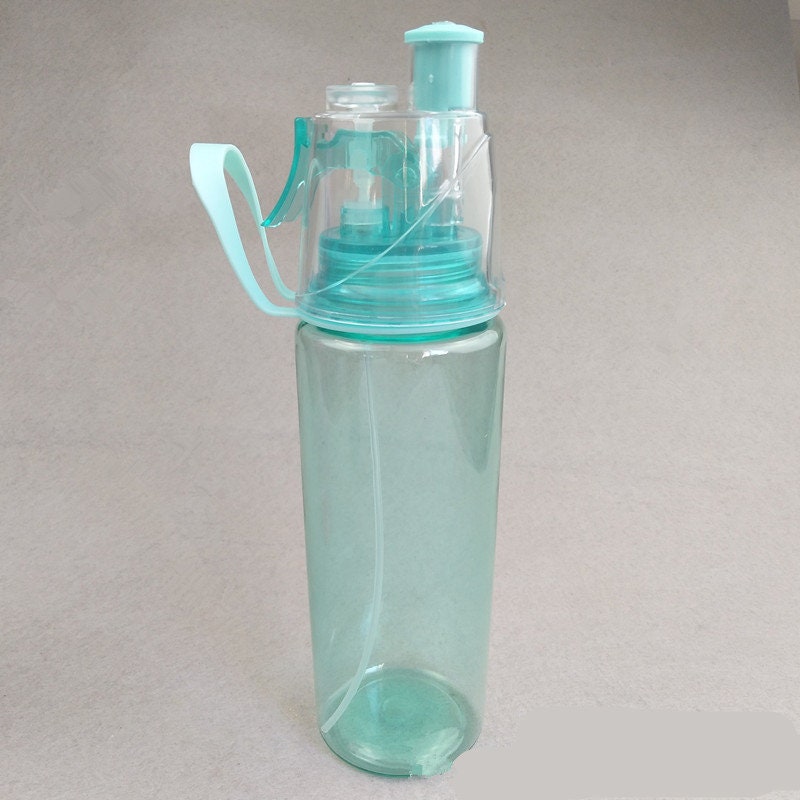 Mist 'N Sip Misting Water Bottle 2-in-1 Mist And Sip Function No Leak Pull Top Spout Sports Water Bottle Reusable Water Bottle - 20 oz